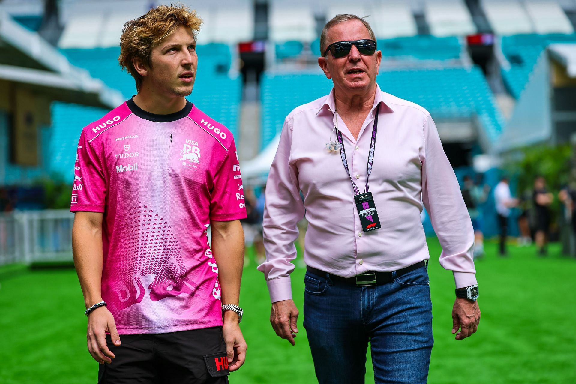 Liam Lawson of New Zealand and Visa Cash App RB walks in the paddock with Martin Brundle of Sky Sports - Source: Getty